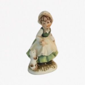 Vintage Brinn’s figurine, girl in green with dog